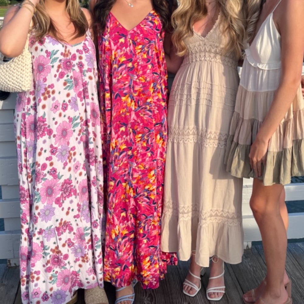 Hot pink dress ! 2nd one from left hand side.